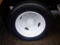 A close-up view of a white wheel with a five-bolt pattern mounted on a black tire suitable for a 2008 Freightliner MT45 Chassis