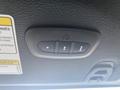 Close-up of the control buttons for the sunroof feature in a 2020 Jeep Wrangler