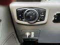 Control panel featuring headlight switch and knob for adjusting various vehicle lighting settings in a 2018 Ford F-550