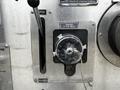 A metal panel featuring a chrome outlet valve labeled Drivers 2-1/2 Inch Inlet with a lever for opening and closing the valve