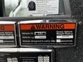 A label showing vehicle specifications for a 2009 Spartan Gladiator including vehicle height weight rating and capacity information.