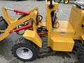 A yellow 2024 AGT Industrial KRW23 Mini Loader with large tires hydraulic arms and various attachment points