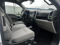 Interior view of a 2017 Ford F-150 showcasing the front seats and dashboard with a focus on fabric upholstery and controls