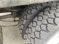 Close-up of a 2017 Ford F-550 tire showcasing its rugged tread design and detailed texture