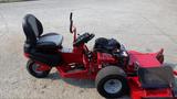 2014 Ferris Mower ISX 800 with a black and red design featuring a comfortable seat two large rear wheels and a front cutting deck