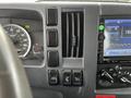 Dashboard of a 2022 Isuzu NPR showing speedometer climate controls and audio display