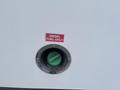 A fuel filler neck with a green cap labeled Diesel Fuel Only