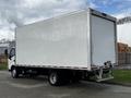 A white 2019 Hino 195 box truck with a large empty cargo area and a rear loading door