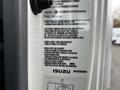 A 2022 Isuzu NPR vehicle identification label displaying vehicle specifications and compliance information