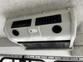 An overhead air conditioning unit designed for a 2016 Ford Econoline with two vents and a control panel
