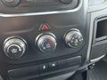 The image shows the climate control panel of a 2015 RAM 1500 featuring three dials for adjusting temperature and airflow settings