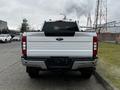 A 2020 Ford F-350 Super Duty viewed from the rear with a white exterior and traditional pickup truck design