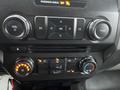 Controls and dashboard features of a 2017 Ford F-150 including knobs for volume climate settings and air conditioning