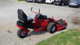 A 2014 Ferris Mower ISX 800 with a black seat and red frame featuring large rear wheels and a cutting deck on the right side