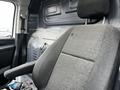 Interior view of a 2018 Mercedes-Benz Metris front seat with a fabric finish and adjustable headrest