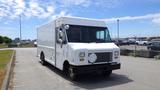 A white 2011 Ford Econoline delivery truck with a boxy design and large windshield, featuring a front grille with a round emblem and side mirrors