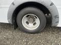 A close-up view of the wheel and tire of a 2017 Chevrolet Express showing a silver rim and black tire with a rugged tread pattern