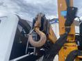 Close-up of a hook attached to a yellow crane arm mounted on a 2017 Ford F-550 truck