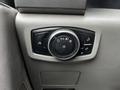 A control panel featuring a circular dial with various settings including headlights and interior lighting for a 2017 Ford F-550