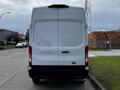 A white 2020 Ford Transit van viewed from the rear with no visible license plate and a clean design