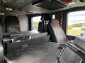 Interior view of a 2009 Spartan Gladiator featuring red-trimmed seats and a central control panel with various buttons and dials