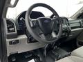 Interior view of a 2017 Ford F-550 showing the steering wheel dashboard and control panel