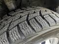 Close-up of a tire on a 2020 Ford Transit showcasing detailed tread patterns designed for traction and durability