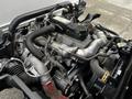 A 2019 Hino 195 engine showing various pipes and components including hoses and a turbocharger system