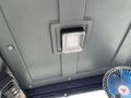 Interior view of the ceiling light in a 2024 AGT Industrial Green QH13R Mini Excavator cabin with a fan on the side