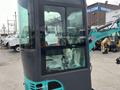 2024 AGT Industrial Green QH13R Mini Excavator with a glass cabin and control panel visible in the foreground