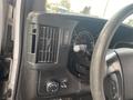 Interior view of a 2016 Chevrolet Express showing the dashboard controls steering wheel and air vents