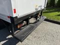 2007 GMC W5500 18 foot cube van with a black diamond plate step and rear access panel visible in the foreground