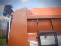 A 2016 International WorkStar 7500 truck with a snow plow attachment visible on the front and safety warnings on the body