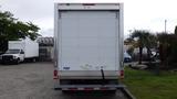 A white 2018 Ford Transit box truck viewed from the rear with a plain cargo door and the branding FRS visibly displayed