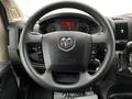 Steering wheel of a 2018 RAM Promaster featuring the RAM logo and various control buttons