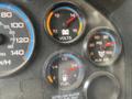 Dashboard gauges of a 2015 International PC105 showing voltmeter fuel level pressure and auxiliary air