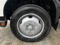 Close-up of a Michelin tire mounted on a silver wheel hub from a 2019 Hino 195 truck with visible tire tread and six lug nuts