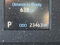 A digital display showing the distance to empty as 638 km and the odometer reading as 23463 km in a 2023 Toyota Tundra