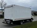 A white 2013 Hino 195 box truck with a blank rear panel and red reflective stripes on the bottom edge