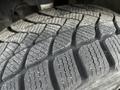 Close-up of a worn tire tread from a 2018 Mercedes-Benz Metris with distinct grooves and patterns visible on the rubber surface