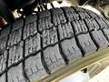 Close-up of the tire tread on a 2018 Ford F-550 showing deep grooves and wear patterns