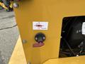 A power switch on a yellow machine with labels indicating the on and off positions