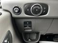 Close-up of the interior dashboard controls of a 2023 Ford Transit including headlight controls and a pull-on lever