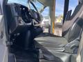 Interior view of a 2017 Chevrolet Express showing the driver's seat and dashboard with steering wheel and controls visible