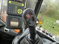 Interior control panel of a 2018 Doosan DL300-5 heavy equipment machine featuring joystick controls and various buttons
