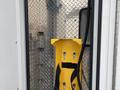 2014 Chevrolet Express with a yellow mounting plate and metal diamond plate interior