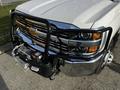 A 2017 Chevrolet Silverado 3500HD with a black front grille guard and a winch mounted on the front bumper