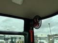 Interior view of a 2024 AGT Industrial Yellow H13R Mini Excavator showing a fan mounted in the cabin