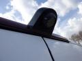 A close-up view of a 2016 Mercedes-Benz Sprinter showing the rear light and a mounted camera or sensor on the roof