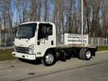 A 2017 Isuzu NQR truck with a flatbed design and no cargo visible on the platform